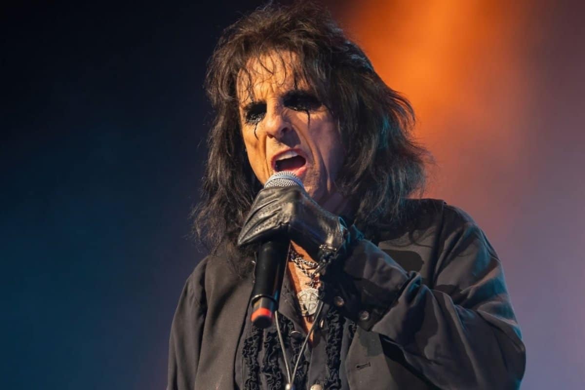 Alice Cooper sings a song on stage.