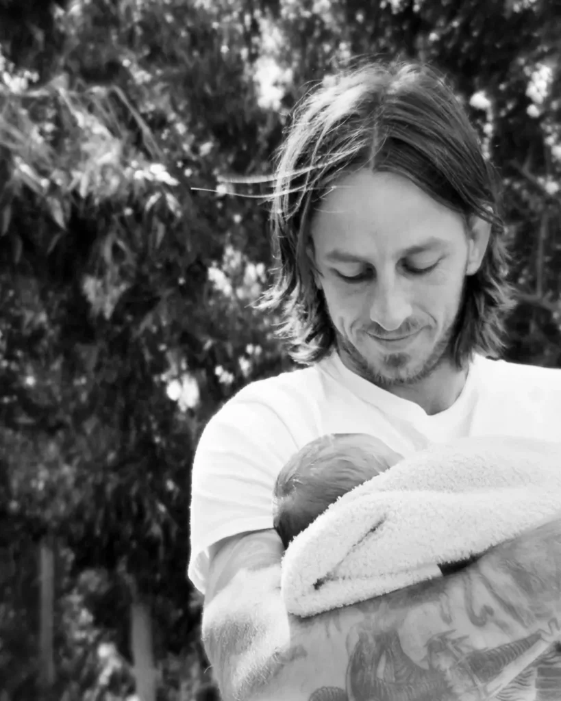 Riley-Hawk-holding-baby-Ronin-Walker-Cobain-Hawk